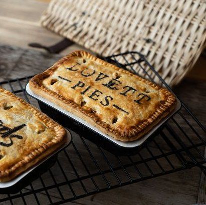 Lovett Pies branding baked into the pastry of a pie photographed on a cooling rack